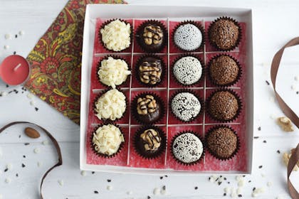 Box of homemade chocolate truffles in DIY gift box