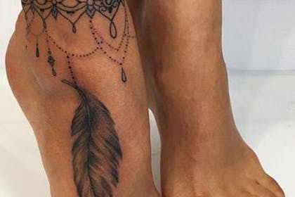 Feather foot tattoo