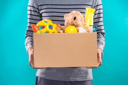 A box of toys in a man's hands