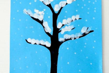 Tree with pattern of snow made from using fingerprint to paint.