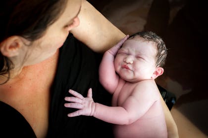 woman holding newborn baby