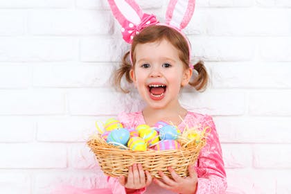 Girl wearing pink bunny ears for Easter