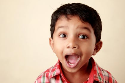 Child with a happy face, mouth wide open