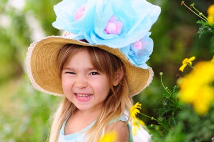 Little girl wearing Easter flower bonnet