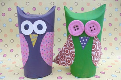 Toilet roll tubes turned into owls with buttons and coloured paper stuck on