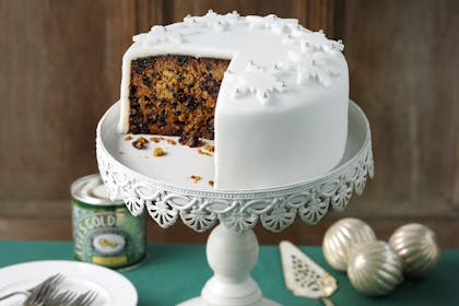 Traditional Christmas cake recipe with marzipan, white fondant icing and snowflake decorations