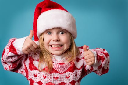 little girl in christmas jumper