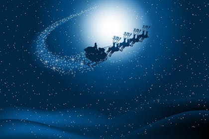 Flying santa sleigh and reindeer at night