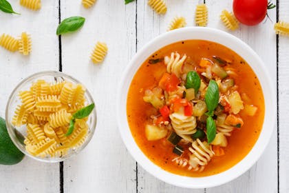 veg and pasta soup with bowl of pasta