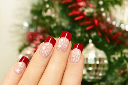 24. Festive red-tipped nails