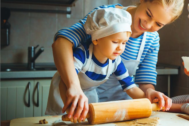 Little boy baking with mother in mother-son bonding