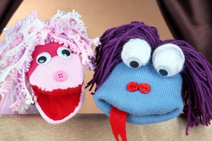 Hand sock puppets with button noses and wool hair