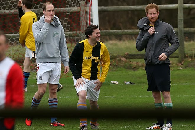 princes william and harry playing football at sandringham