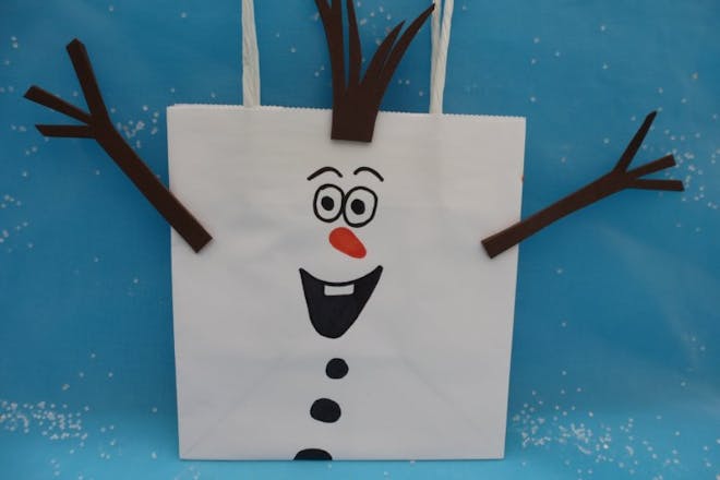 A paper bag drawn to look like Olaf the snowman for a Frozen party