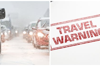 travel warning and snowy traffic jam