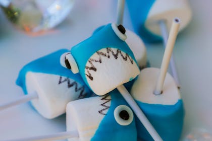 Marshmallows decorated with icing to look like sharks