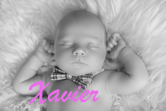 Sleeping baby wearing bowtie, text says Xavier