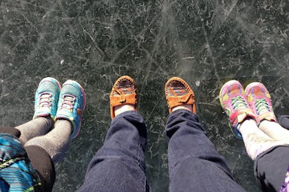 Feet standing on ice