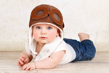 baby wearing flying hat