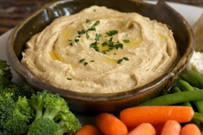 hummus in a dish with vegetables