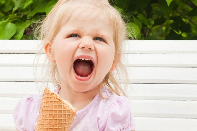 girl with ice cream cone screaming