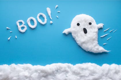 Cotton wool ghost against blue background with 'Boo' written beside it