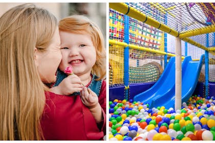 Mum cuddles toddler daughter / soft play centre