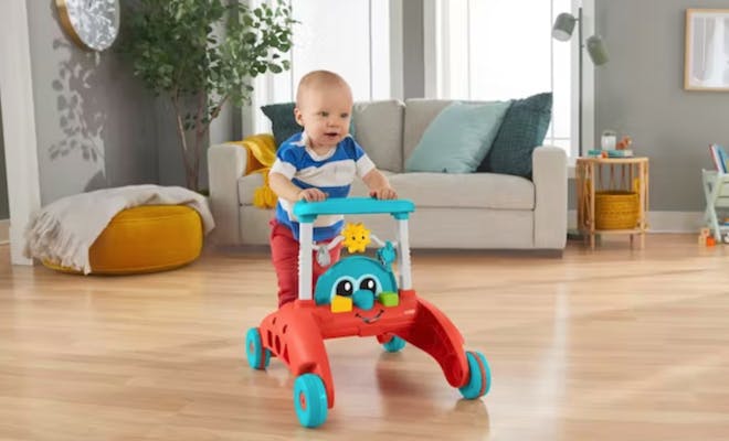 Baby with Fisher-Price® 2-Sided Steady Speed™ Walker 