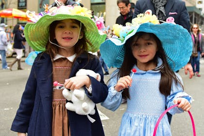 Two girls wear Easter bonnets