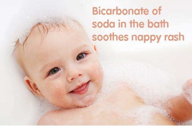 happy baby with bubbles in bath