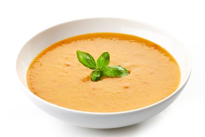 Butternut squash soup in a white bowl