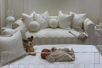 Newborn Bambi in her clear acrylic cot