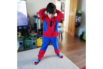 Boy dressed in Spiderman pyjamas costume