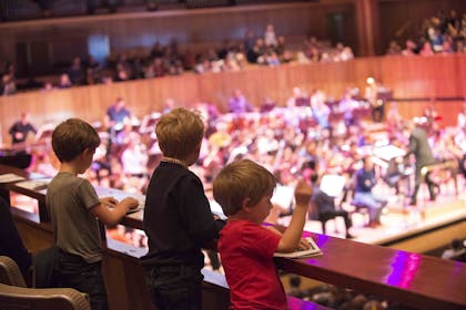 Three young children enjoying a FUNharmonics Concert at the Southbank Centre