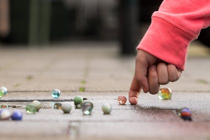 Child playing with marbles