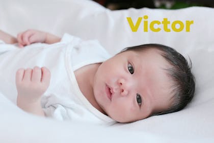 Baby lying down. Name Victor written in text