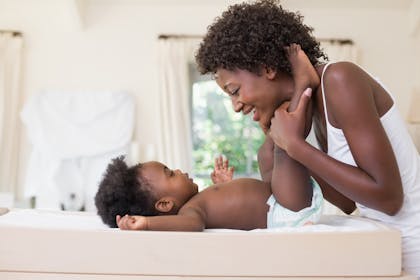 mum with baby on changing table