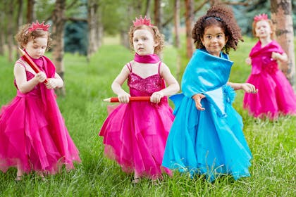 Girls dressed as princesses playing musical statues