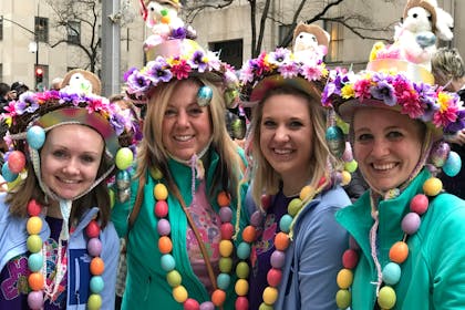 Four ladies wearing Easter bonnets with bunnies