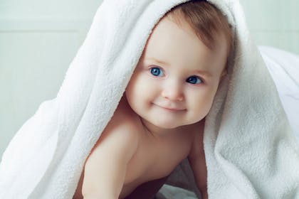 baby under towel