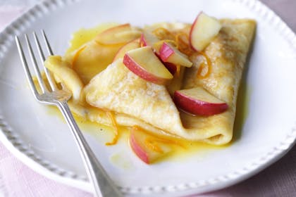 Pancakes with buttery apple sauce recipe. French Crepes Suzette with apples.