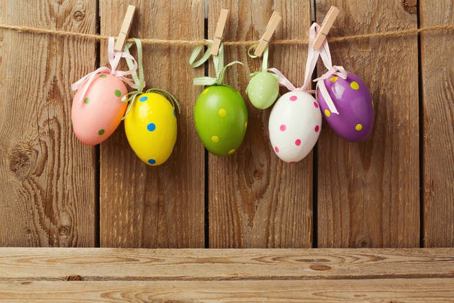 easter eggs tied up with ribbon and string