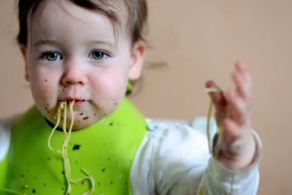 baby eating spaghetti
