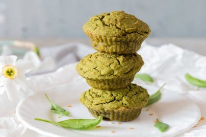 Stack of three spinach muffins on a plate