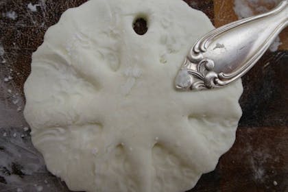 cornflour clay decoration with pattern made by spoon