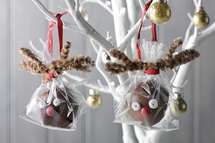 Red-nosed reindeer, rocky-road covered in melted chocolate and decorated to look like Rudolph