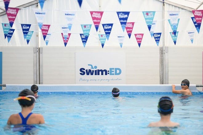 Kids learn to swim in a pop-up pool from Progressive Sports