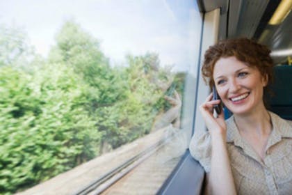 woman on train talking on mobile