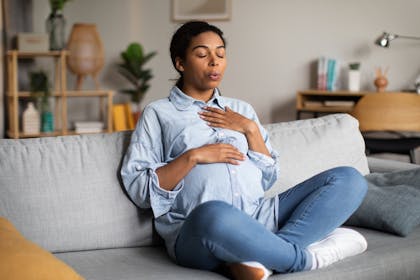 pregnant woman practicing deep breathing