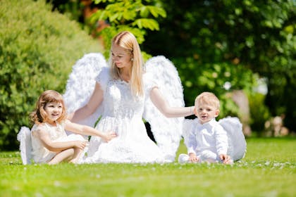 Mum dressed as guardian angel with son and daughter